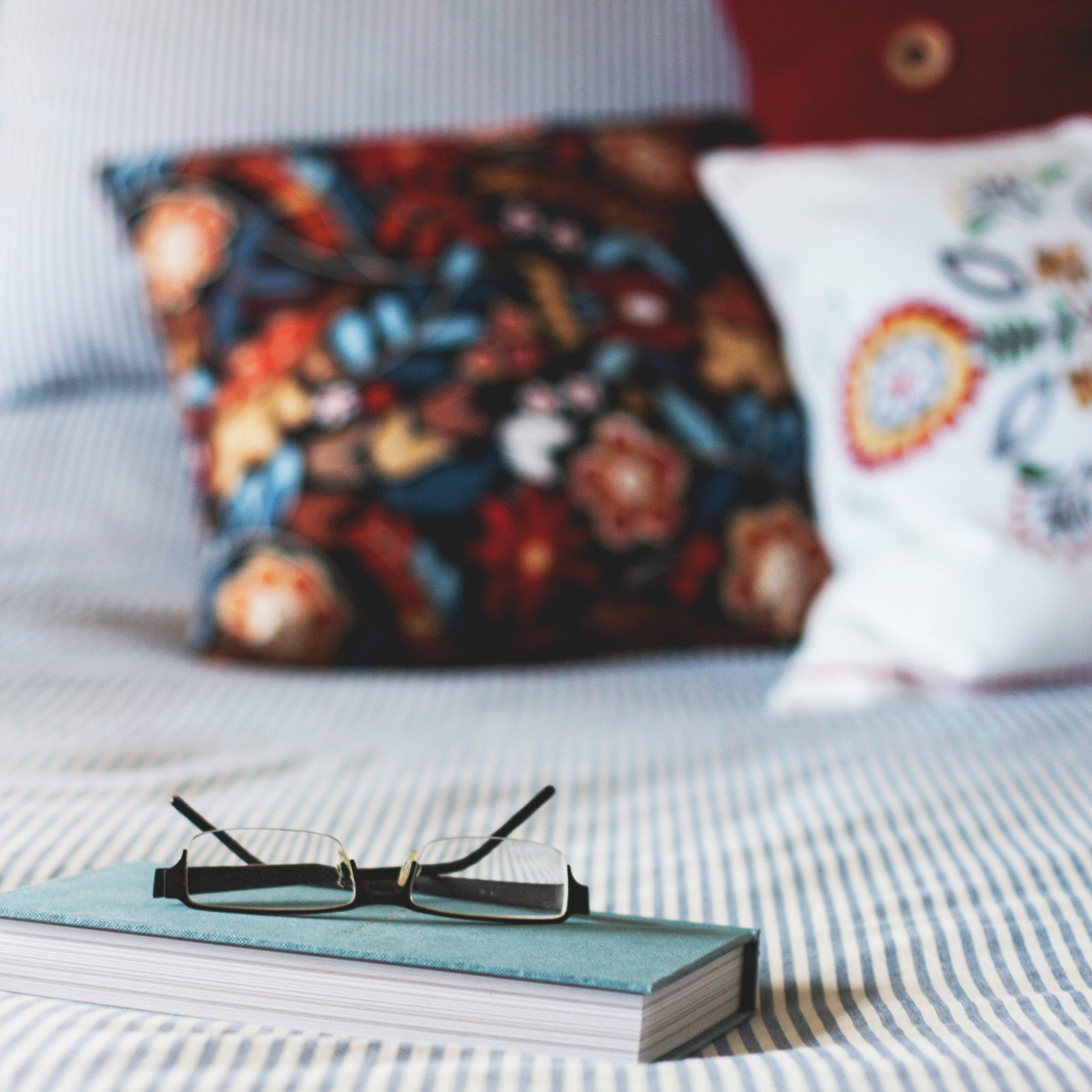 Emma Mattress glasses book in bed