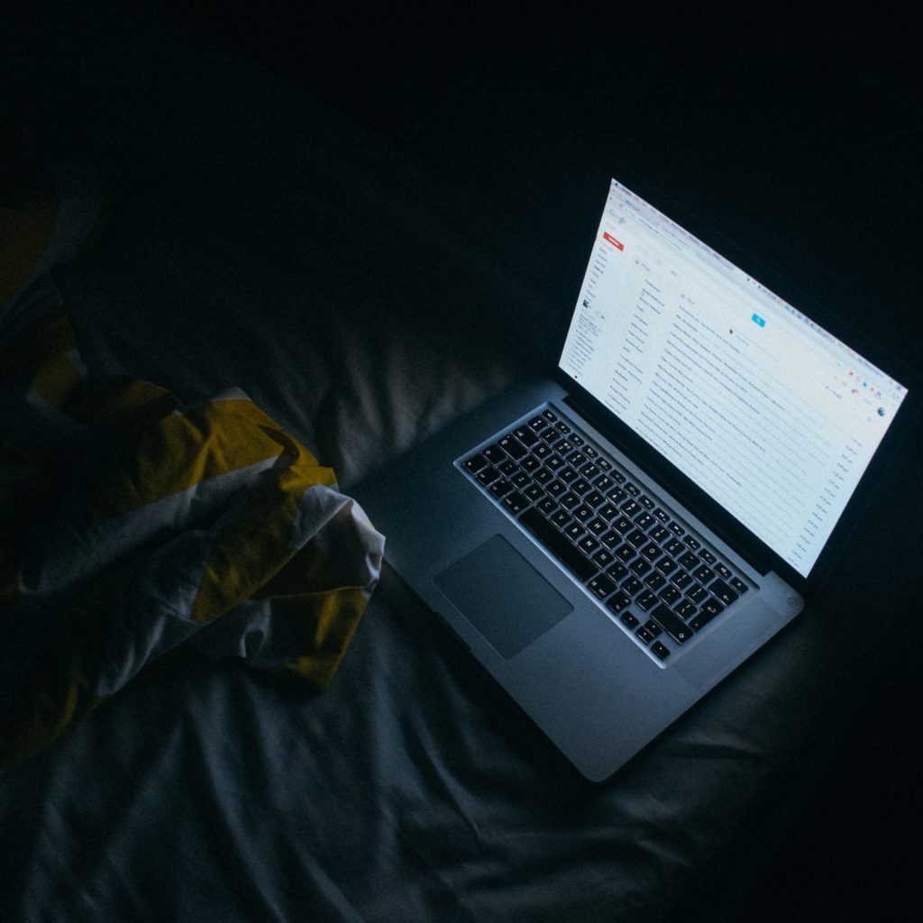 Emma Mattress laptop in bed